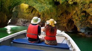 Couple on a Boat in the Fine Arts Cave at Ponta da Piedade