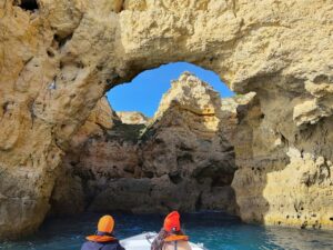 2 customers in boat entering the Cathedral cave